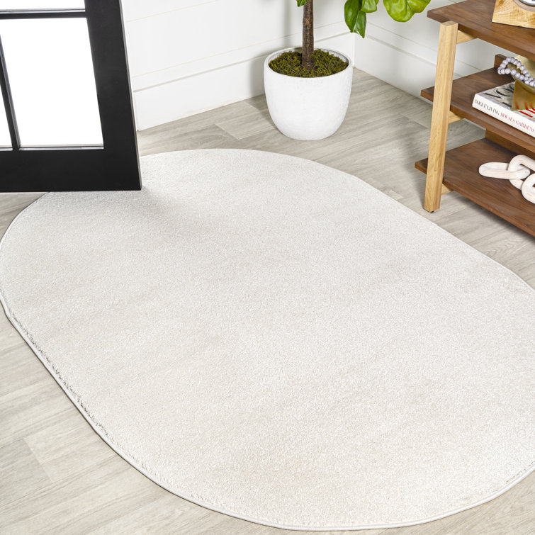 Cream Oval Machine Woven Stain-Resistant Polypropylene Area Rug