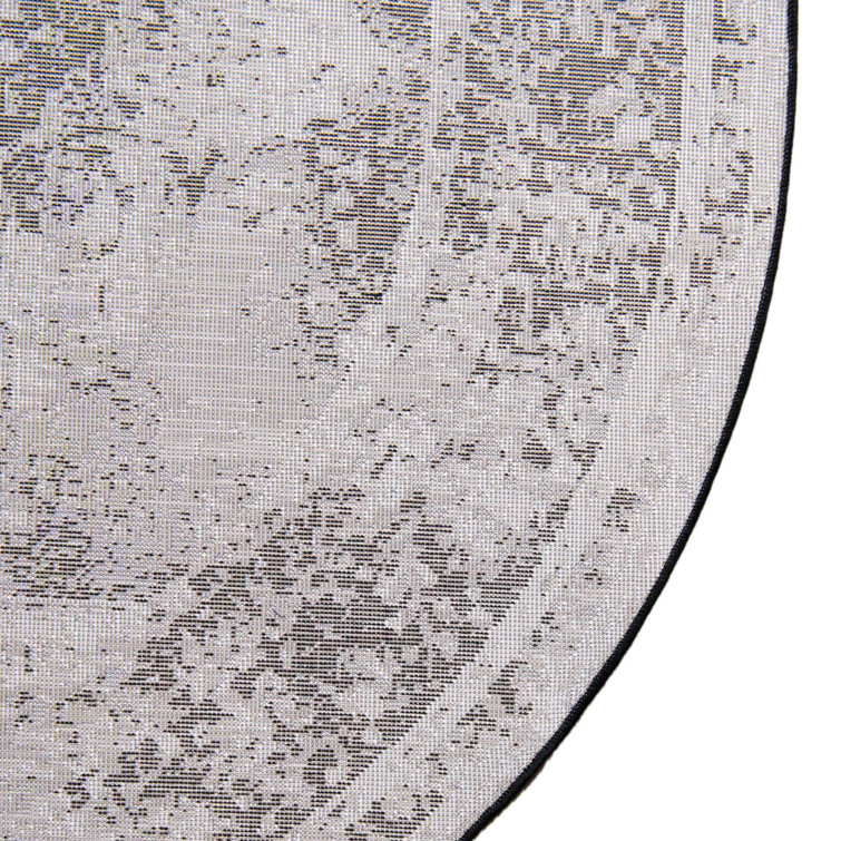 Oval 9' x 12' Black and Brown Synthetic Oriental Rug