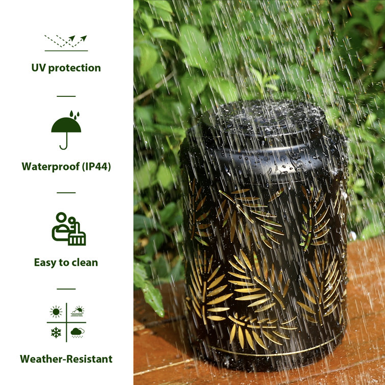 Black Metal Cylinder Solar Powered Outdoor Lantern with Leaf Cutouts