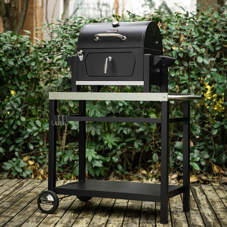 Compact Black Steel Portable Charcoal Grill with Warming Rack