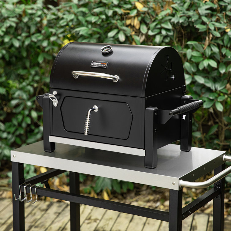 Compact Black Steel Portable Charcoal Grill with Warming Rack