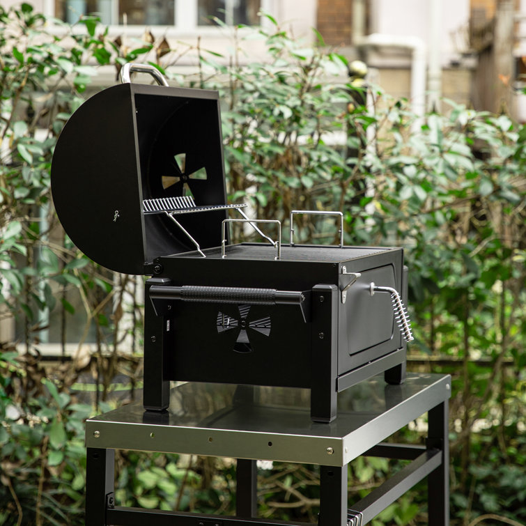 Compact Black Steel Portable Charcoal Grill with Warming Rack