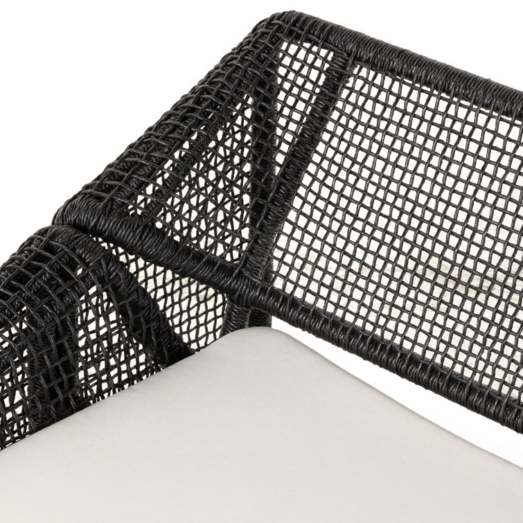 Curved Black Wicker Outdoor Sectional Sofa with White Cushions