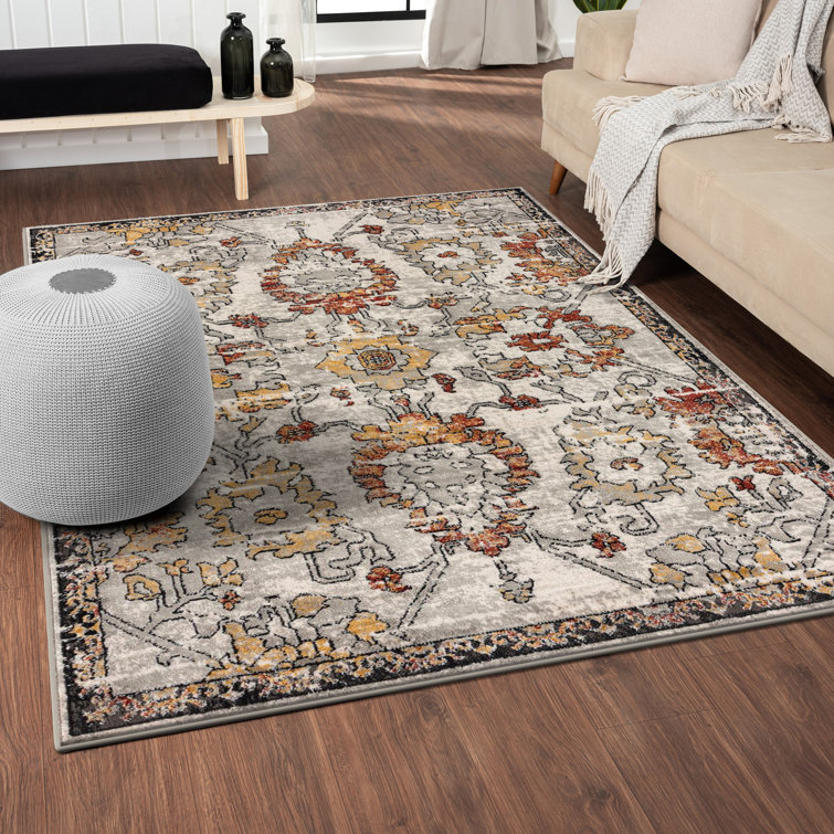 Distressed Orange and Beige Floral 6' x 9' Synthetic Area Rug