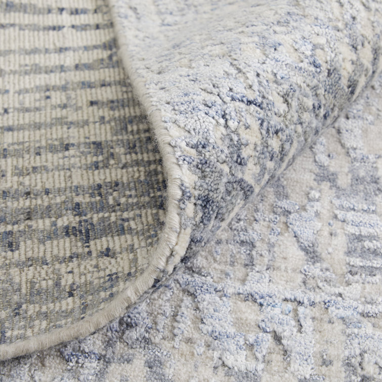 Handmade Blue and Ivory Wool Viscose Abstract Area Rug