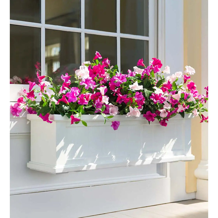 Purple and Yellow Artificial Petunias in Brown Pot