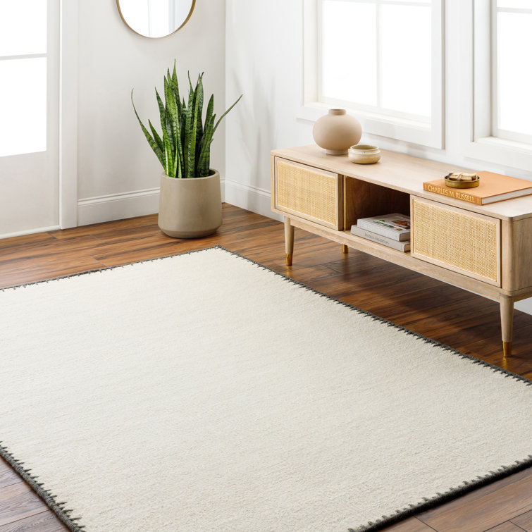 Handmade Beige Wool 8' x 10' Area Rug with Black Border