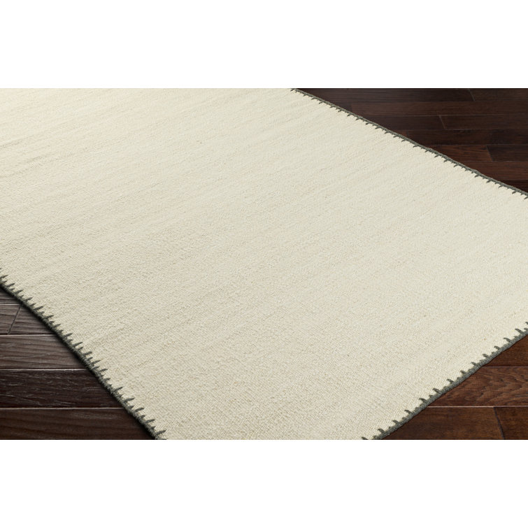 Handmade Beige Wool 8' x 10' Area Rug with Black Border