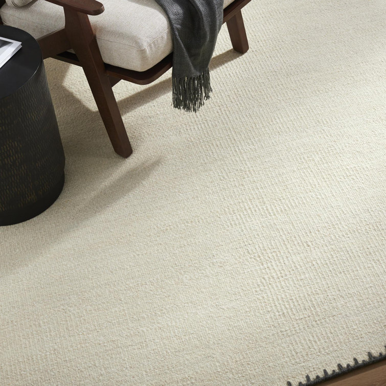 Handmade Beige Wool 8' x 10' Area Rug with Black Border