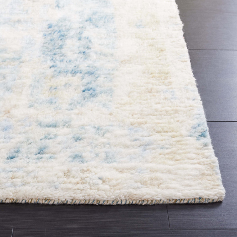 Hand-Knotted Blue and Ivory Wool 6' x 9' Area Rug