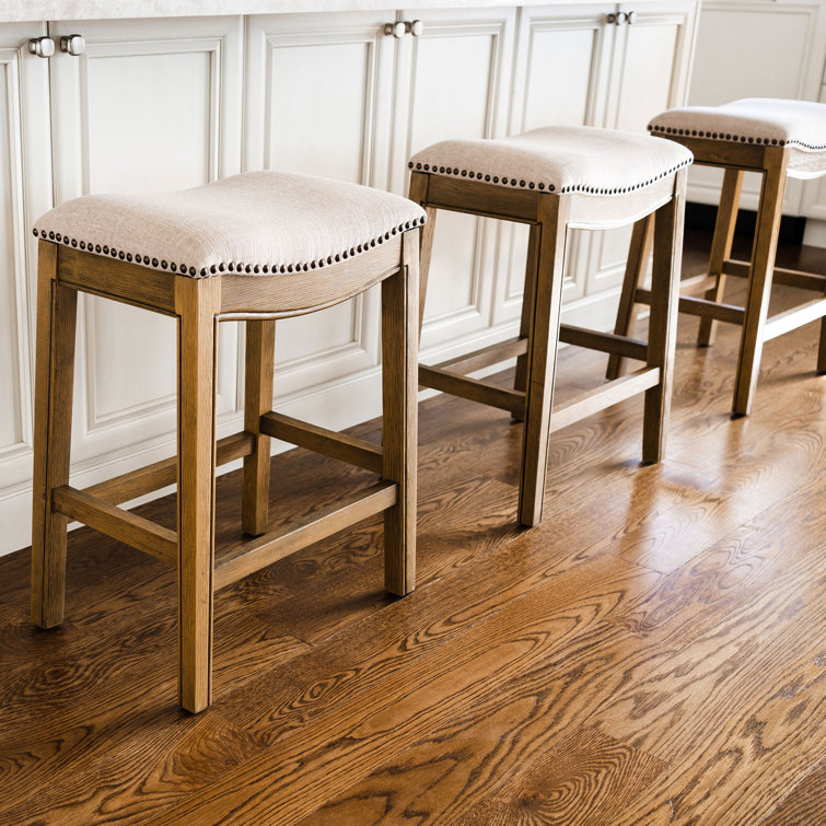Adrien Brown Backless Saddle Wood Counter Stool