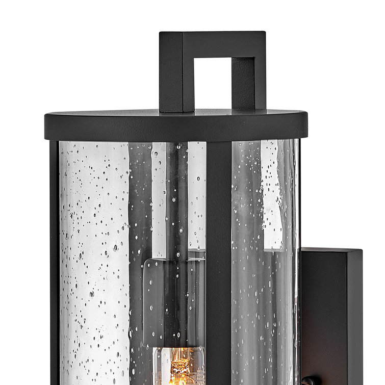Medium Black Aluminum Cylinder Outdoor Wall Light with Seeded Glass
