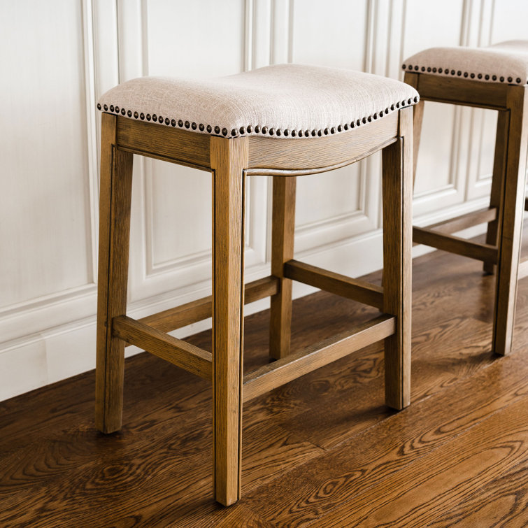 Adrien Brown Backless Saddle Wood Counter Stool