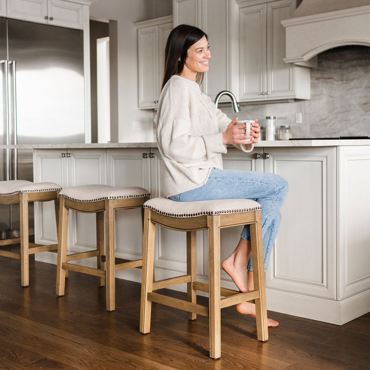 Adrien Brown Backless Saddle Wood Counter Stool