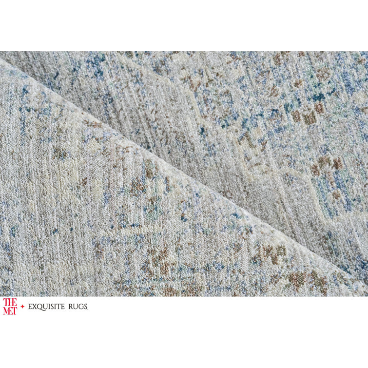 Vintage Blue and Beige 10' x 14' Synthetic Area Rug