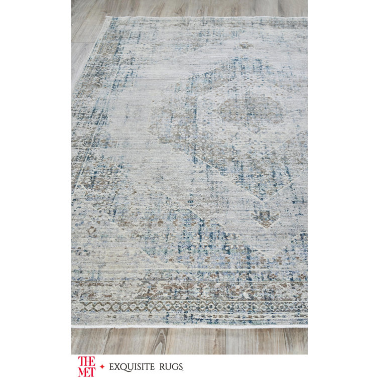 Vintage Blue and Beige 10' x 14' Synthetic Area Rug