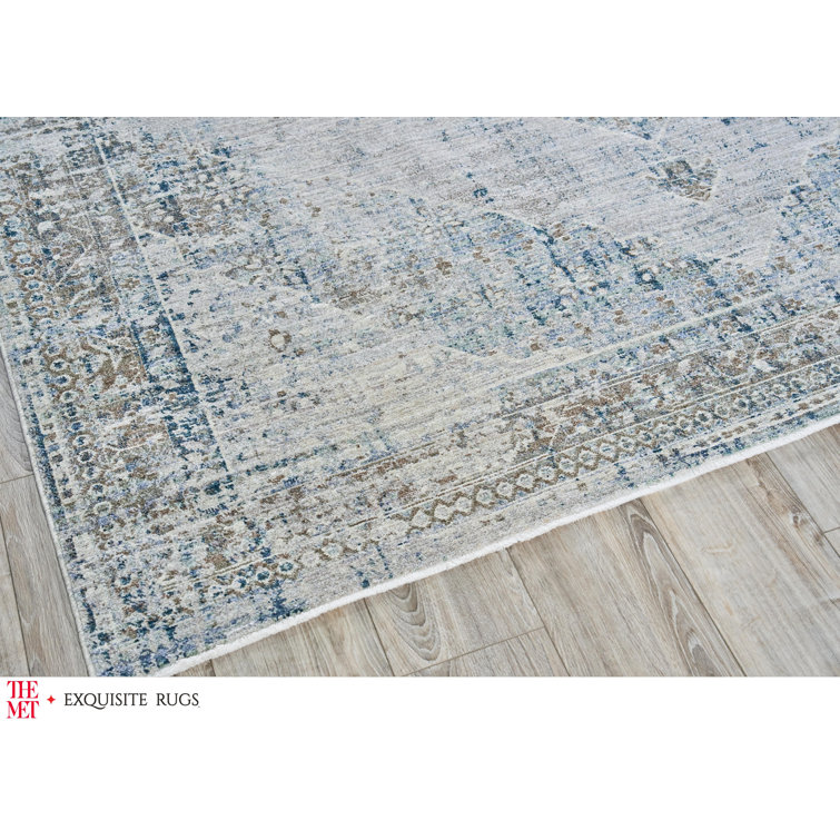 Vintage Blue and Beige 10' x 14' Synthetic Area Rug