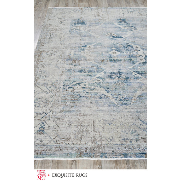 Vintage Inspired Light Blue and Beige 10' x 14' Synthetic Area Rug
