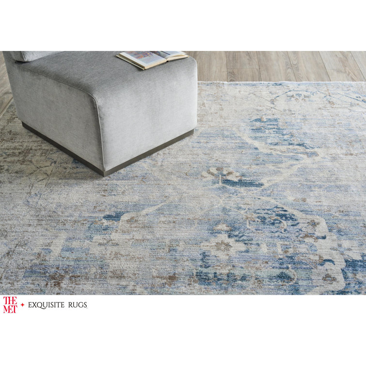 Vintage Inspired Light Blue and Beige 10' x 14' Synthetic Area Rug