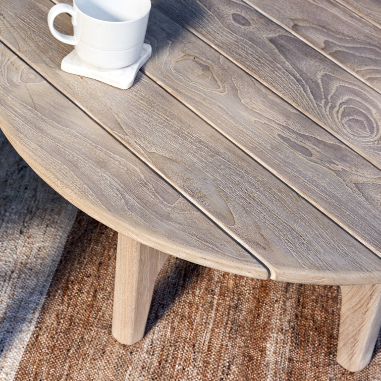 Gray Teak Wood Round Coffee Table with Sculpted Cross Base