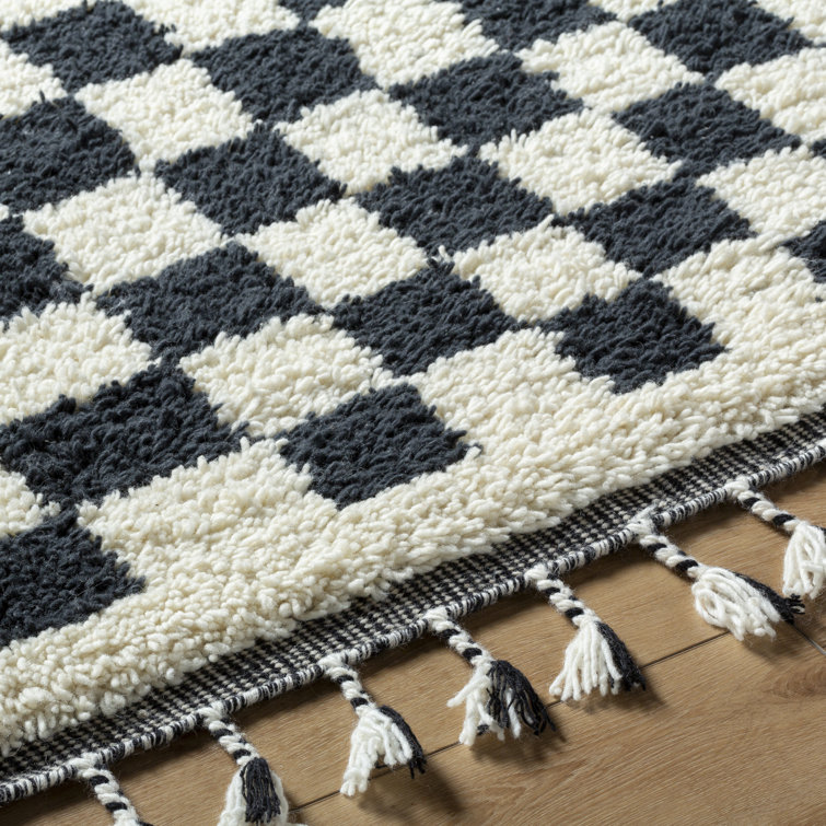 Black and Ivory Geometric Wool Rug with Tassels