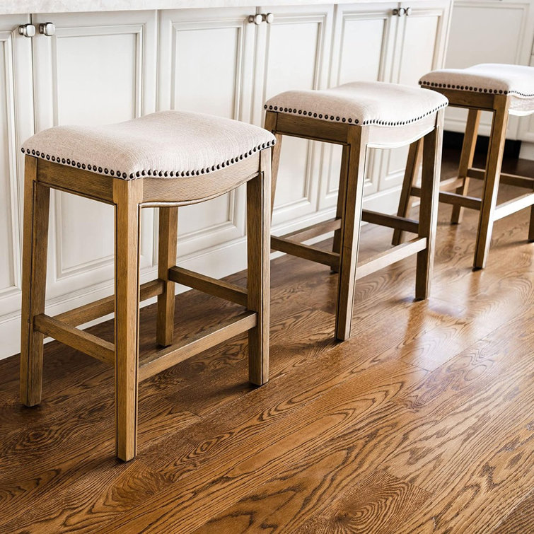 Adrien Brown Backless Saddle Wood Counter Stool