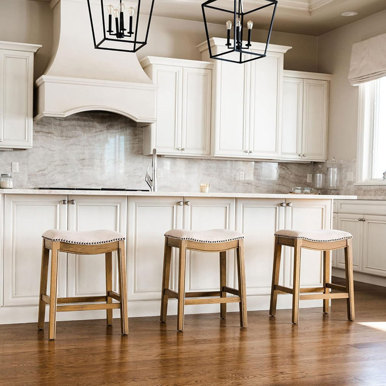 Adrien Brown Backless Saddle Wood Counter Stool