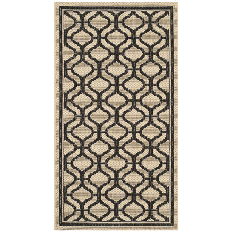 Cream and Black Geometric 8' x 10' Synthetic Rug