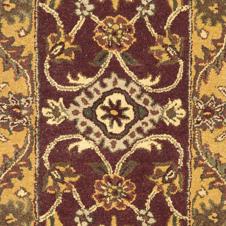 Handmade Round Burgundy and Gold Wool Area Rug