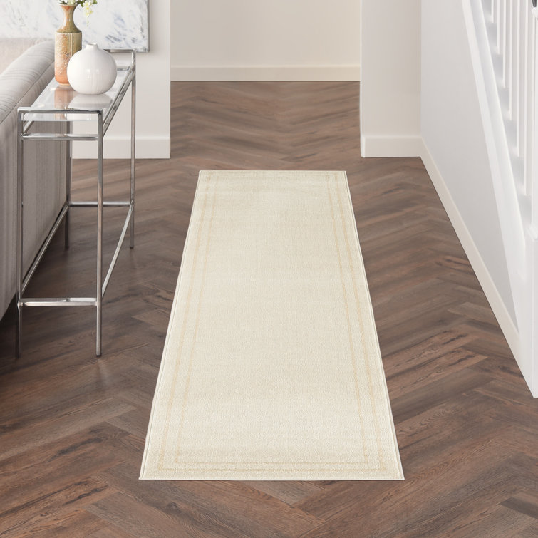Ivory Solid Synthetic Low Pile Rectangle Rug 4' x 6'