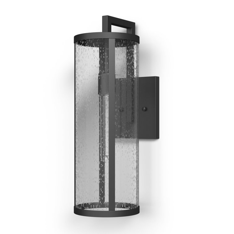 Medium Black Aluminum Cylinder Outdoor Wall Light with Seeded Glass