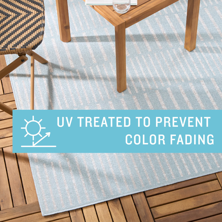 Blue and Ivory Striped Synthetic 5' x 7' Indoor/Outdoor Rug