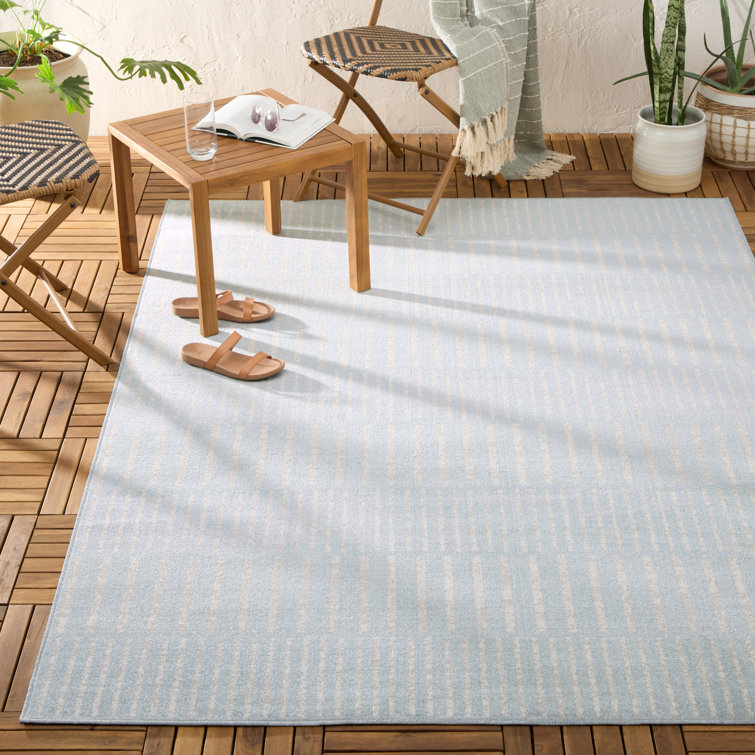 Blue and Ivory Striped Synthetic 5' x 7' Indoor/Outdoor Rug