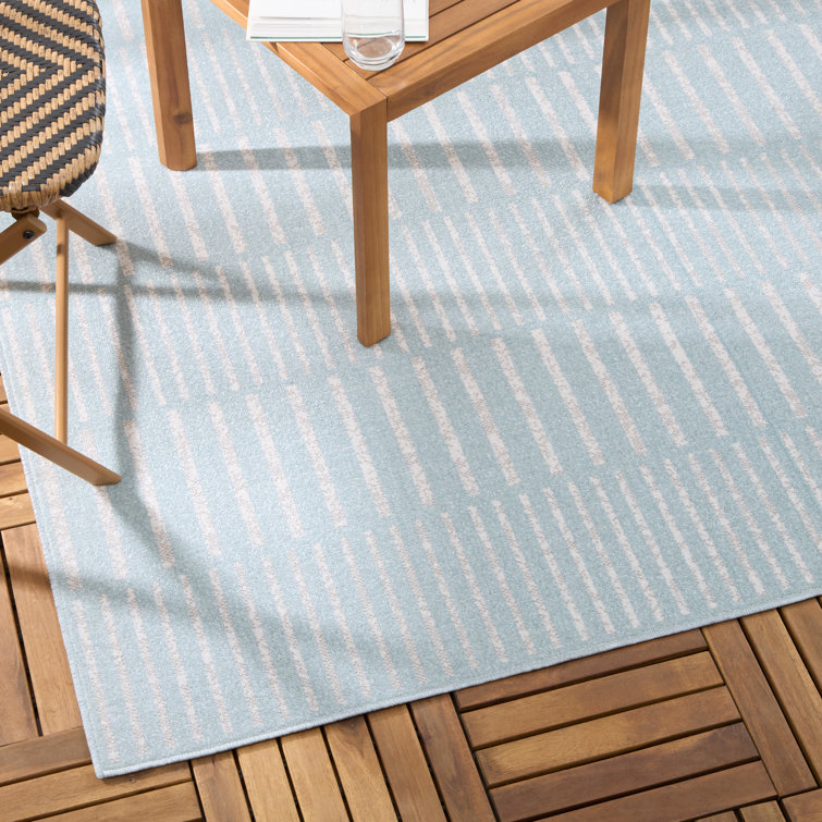 Blue and Ivory Striped Synthetic 5' x 7' Indoor/Outdoor Rug