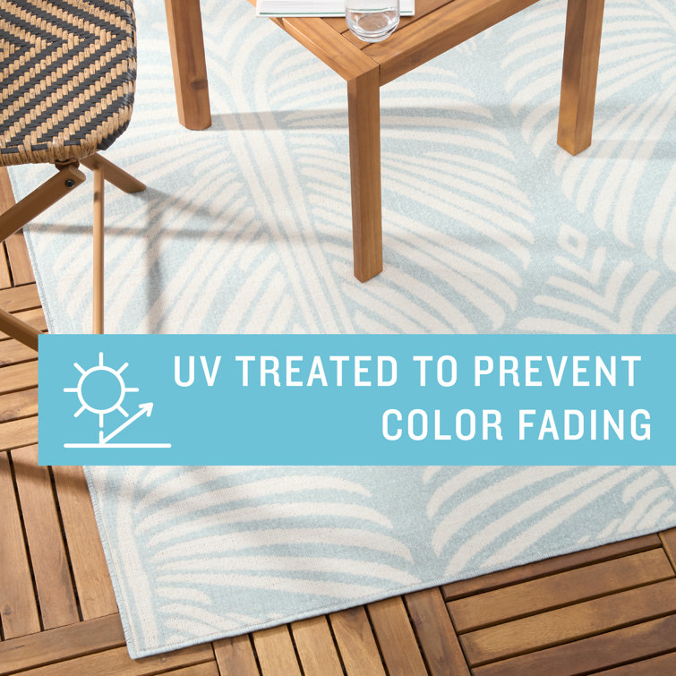 Lanai Blue and Ivory Palm Leaves Synthetic Indoor/Outdoor Area Rug