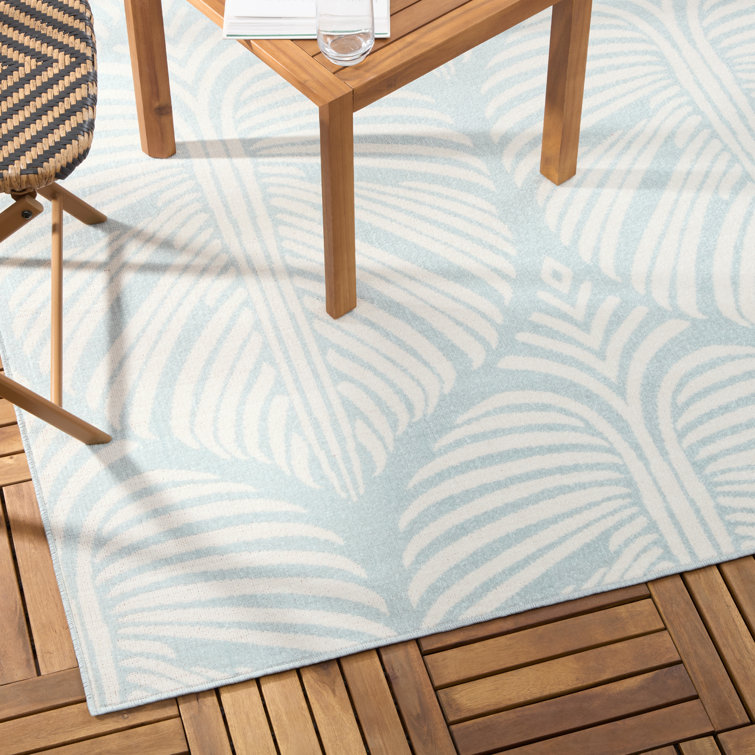 Lanai Blue and Ivory Synthetic Palm Leaves Rectangular Rug