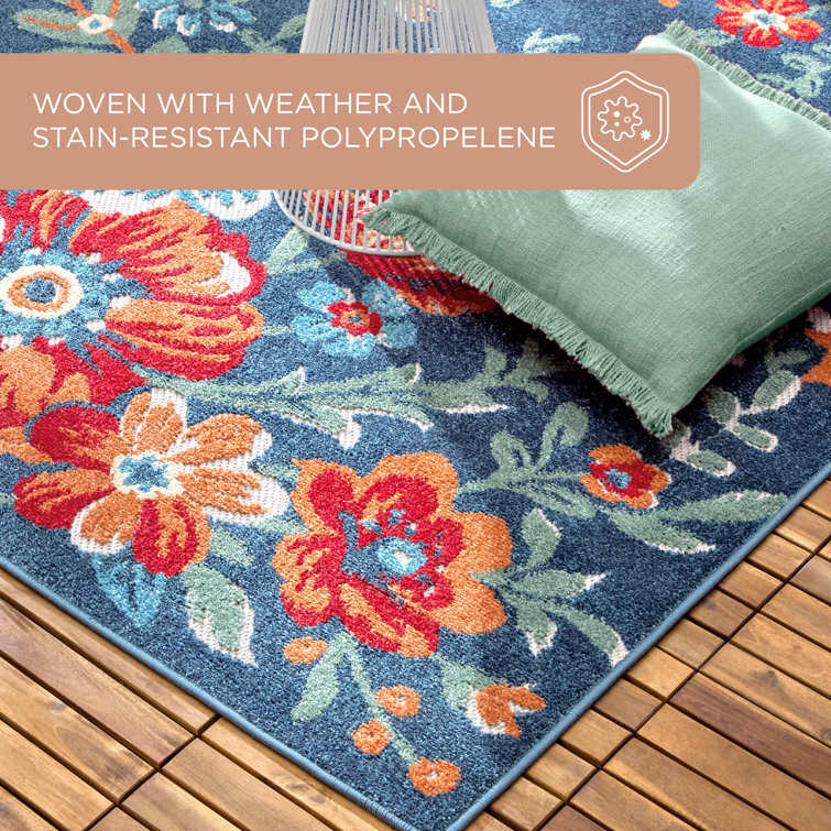Hibiscus Bloom Blue and Red Floral Synthetic Area Rug