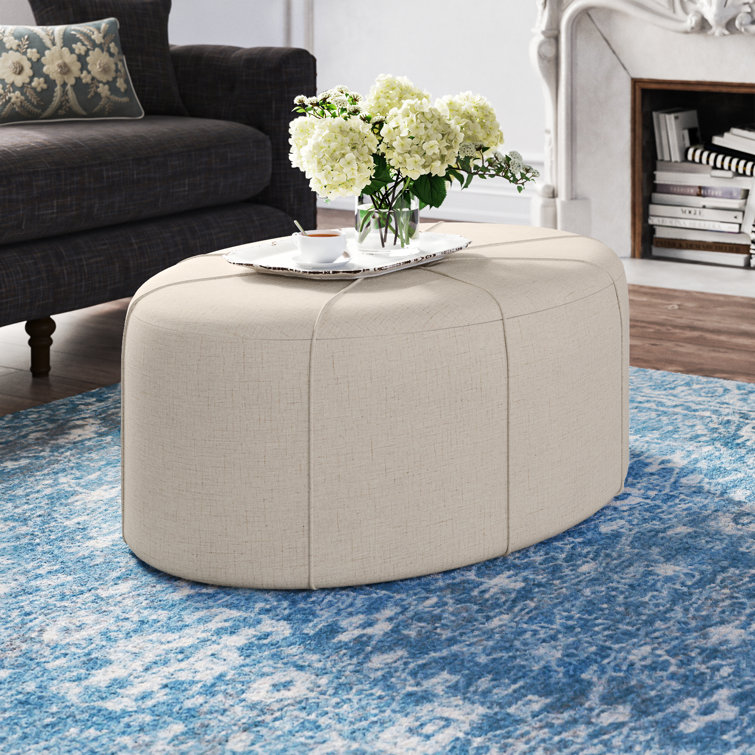 Elegant Cream Melange Tufted Oval Ottoman