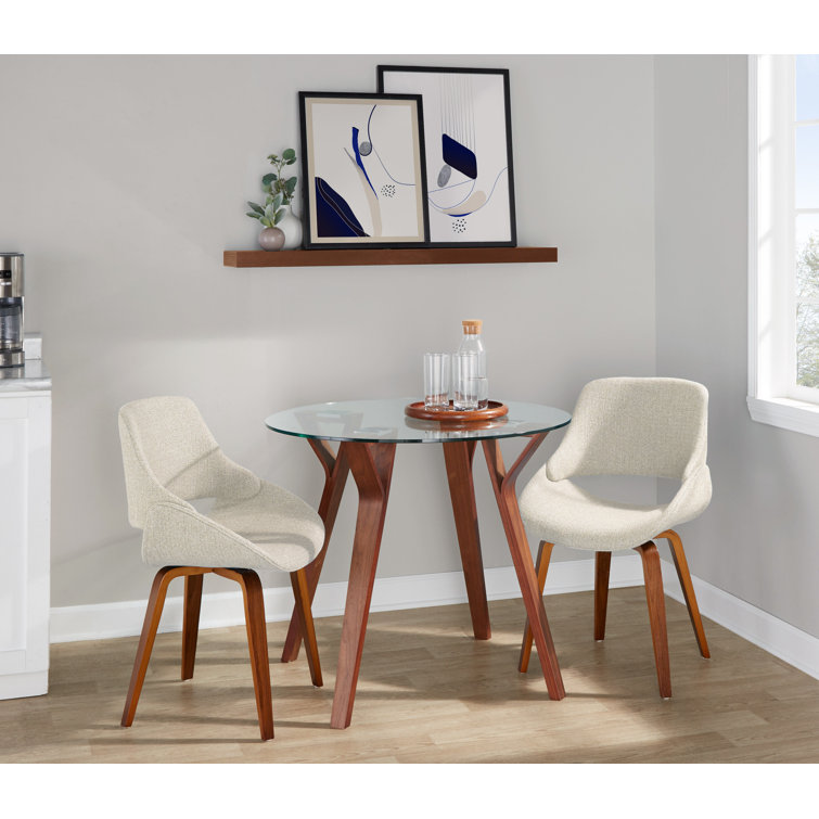 Clear Glass Round Dining Table with Cream Upholstered Chairs