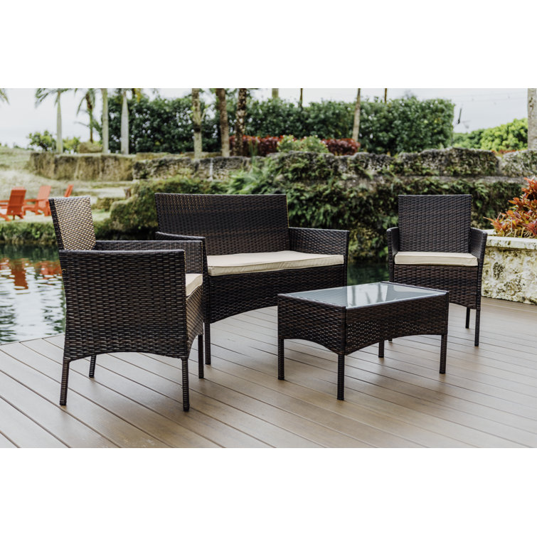 4-Piece Brown Wicker Outdoor Seating Set with Beige Cushions