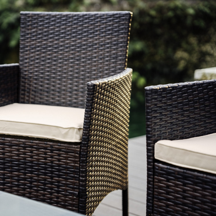 4-Piece Brown Wicker Outdoor Seating Set with Beige Cushions