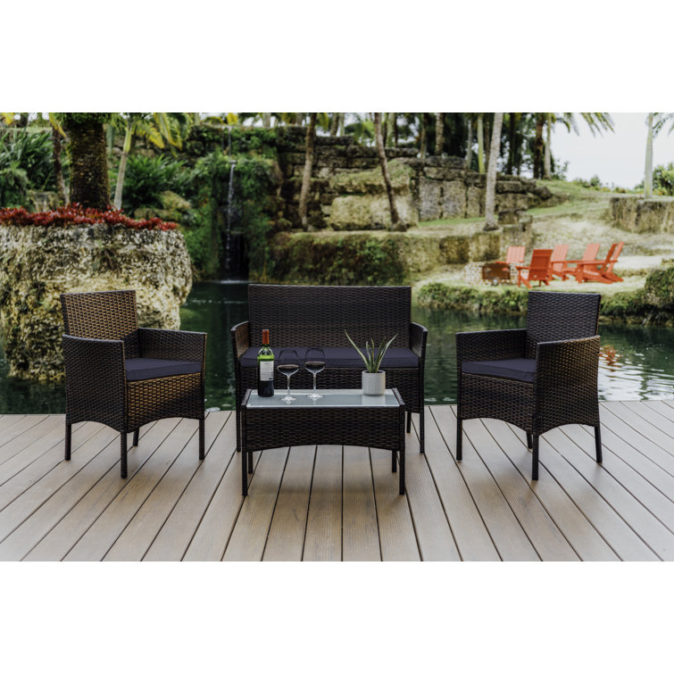 4-Piece Brown Wicker Outdoor Seating Set with Blue Cushions