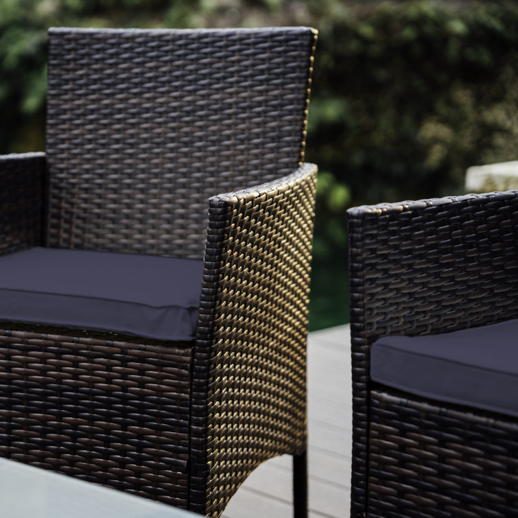 4-Piece Brown Wicker Outdoor Seating Set with Blue Cushions