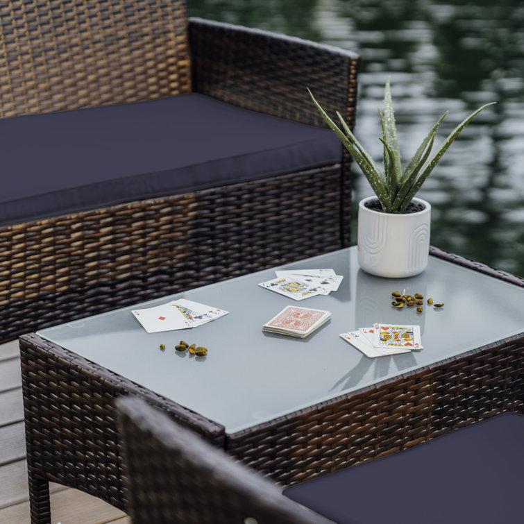 4-Piece Brown Wicker Outdoor Seating Set with Blue Cushions
