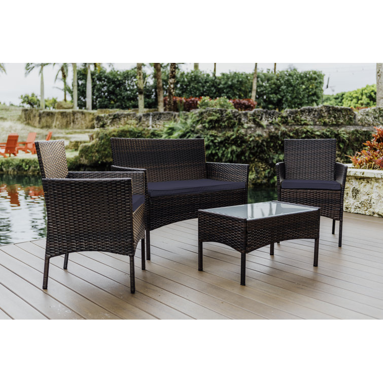 4-Piece Brown Wicker Outdoor Seating Set with Blue Cushions