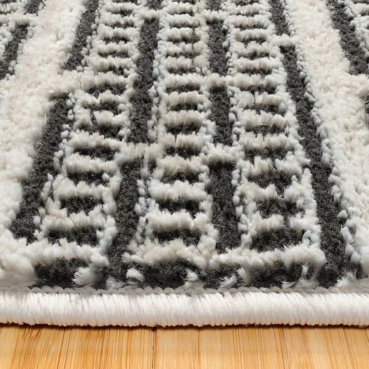Missha Dario Beige Black Tufted Synthetic 6' x 9' Area Rug