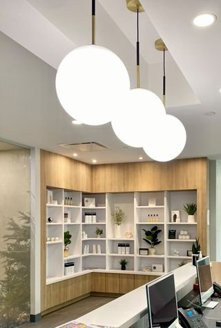 Vesper Satin Brass & Black Globe Pendant with Dimmable White Glass Shade