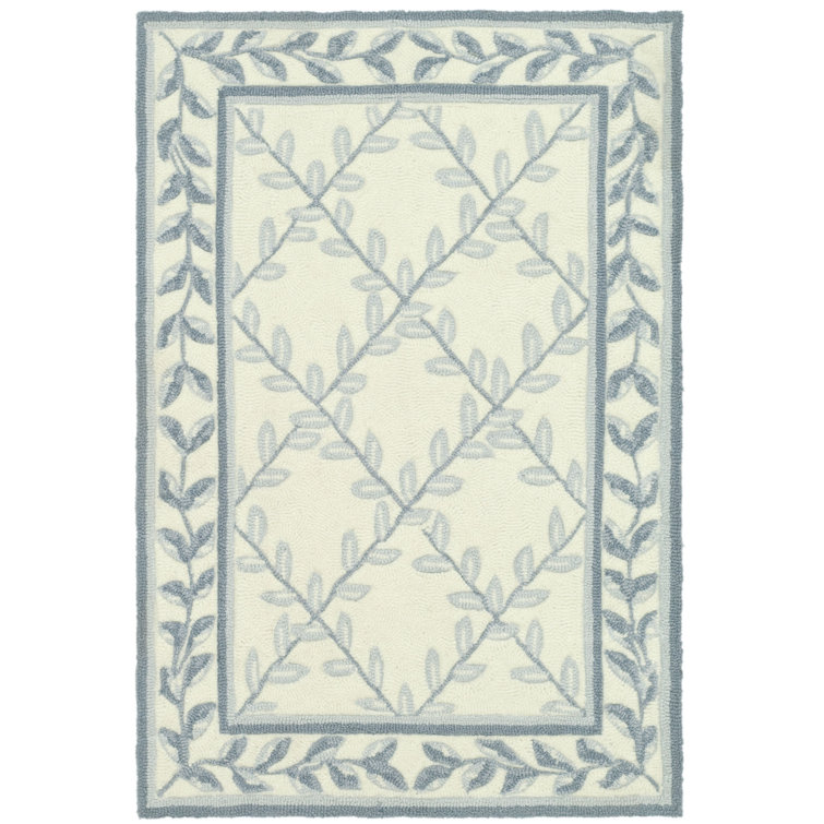 Ivory and Light Blue Tufted Synthetic Area Rug, 2' x 3'