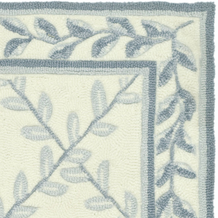 Ivory and Light Blue Tufted Synthetic Area Rug, 2' x 3'
