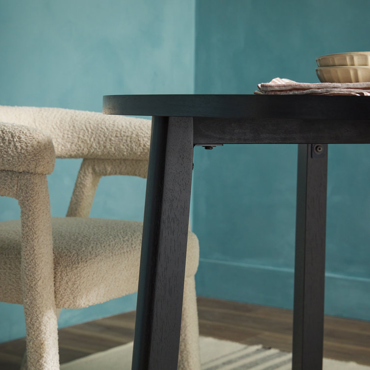 Black Solid Wood Round Dining Table with Geometric Legs